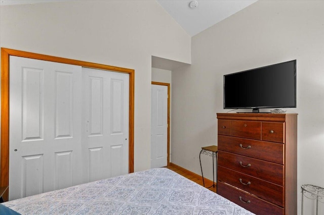 250 Grouse Run, Cresco, PA 18326 - bedroom with vaulted ceiling, a closet, wood finished floors, and baseboards