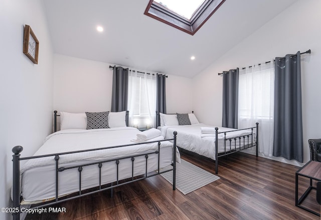 bedroom featuring lofted ceiling with skylight, recessed lighting, multiple windows, and wood finished floors