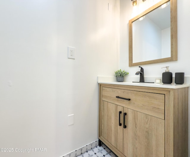 bathroom with tile patterned floors and vanity