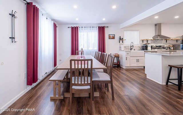 dining area with recessed lighting, dark wood finished floors, and baseboards