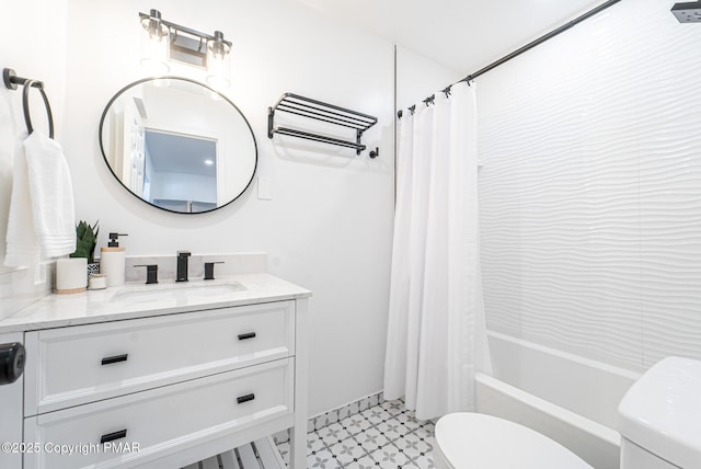 bathroom with shower / tub combo, vanity, and toilet