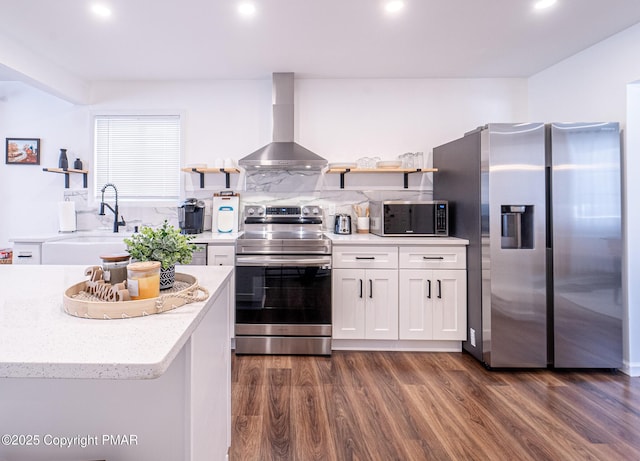 kitchen with stainless steel appliances, wall chimney range hood, dark wood-type flooring, and open shelves