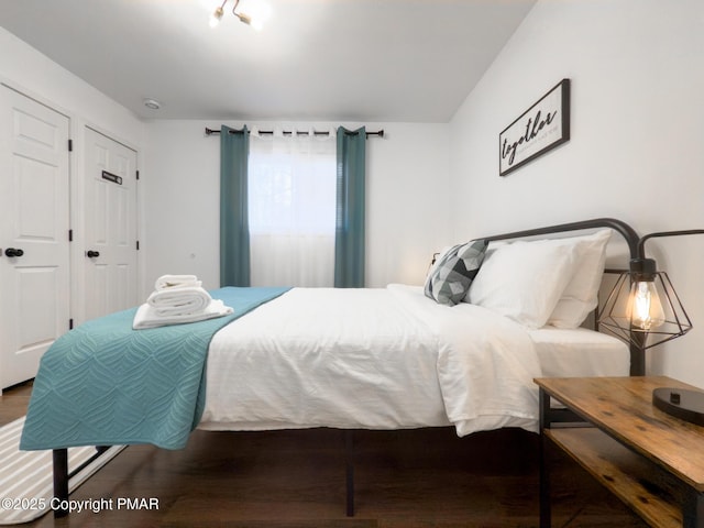 bedroom with wood finished floors