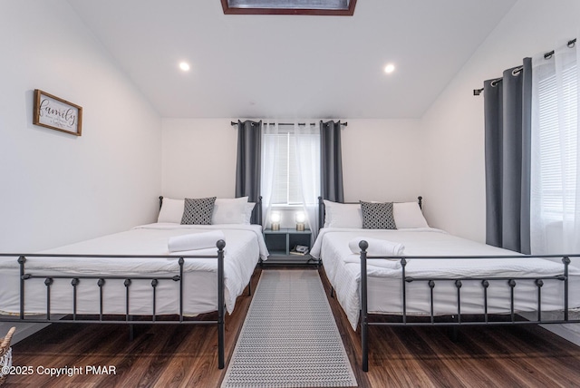 bedroom with vaulted ceiling, wood finished floors, and recessed lighting