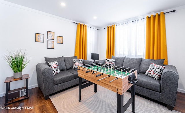 recreation room featuring recessed lighting, baseboards, and wood finished floors