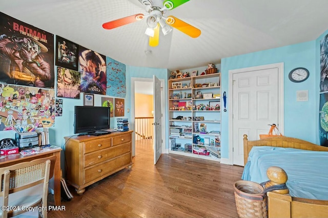 bedroom with ceiling fan and wood finished floors