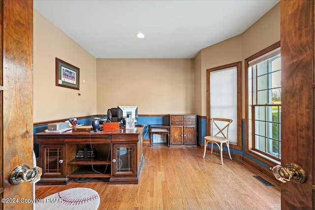 office featuring wood finished floors and visible vents