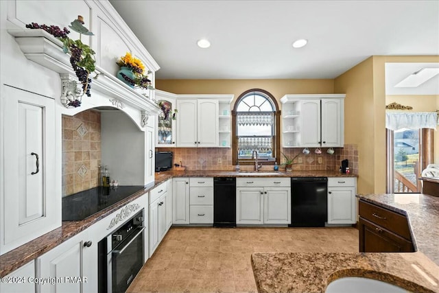 kitchen featuring white cabinets, a sink, black appliances, and open shelves