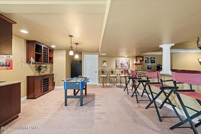 recreation room with baseboards, recessed lighting, decorative columns, and light colored carpet