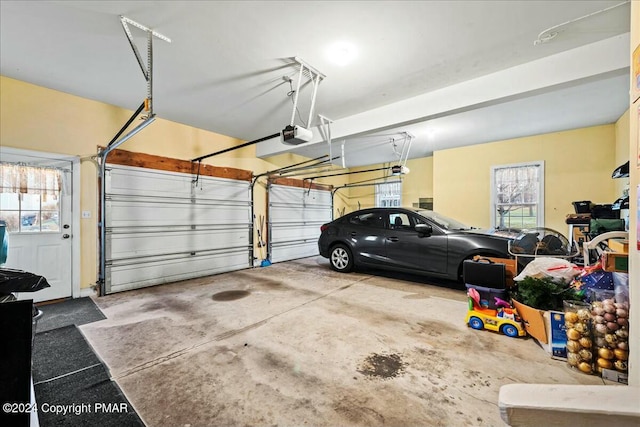 garage featuring a garage door opener