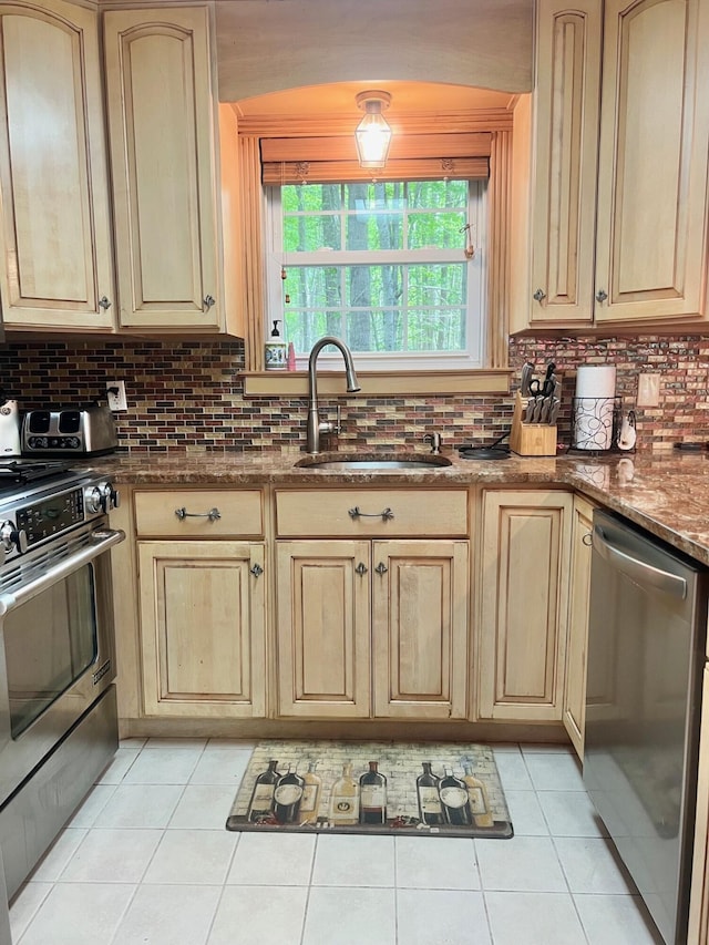 223 Outer Dr, Pocono Lake, PA 18347 - kitchen with appliances with stainless steel finishes, a sink, light tile patterned floors, and light brown cabinets