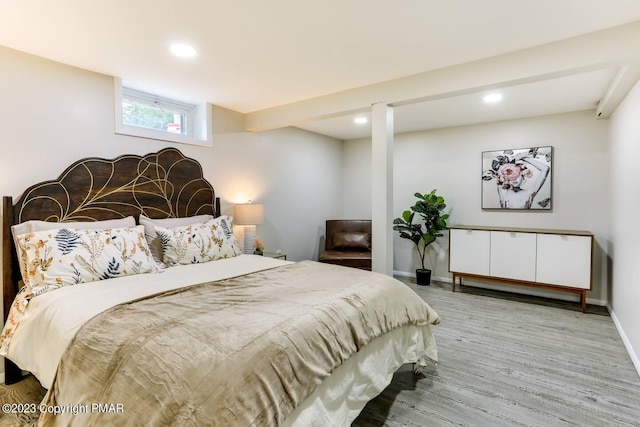 bedroom with recessed lighting, baseboards, and wood finished floors