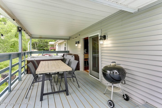 wooden deck featuring outdoor dining space