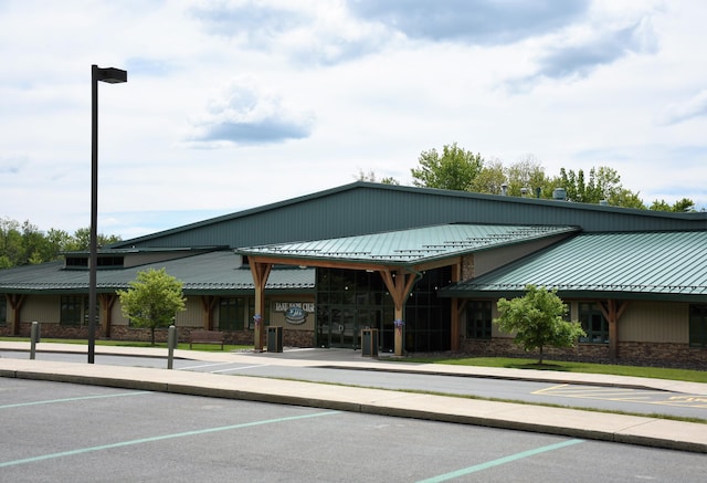 view of property featuring uncovered parking