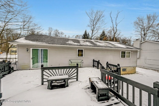 view of snow covered house