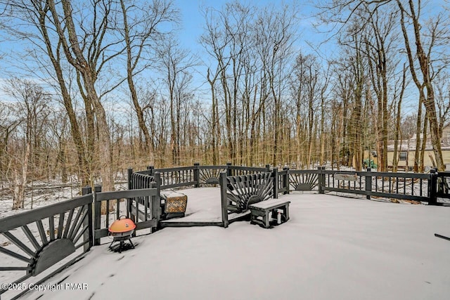 view of snow covered deck