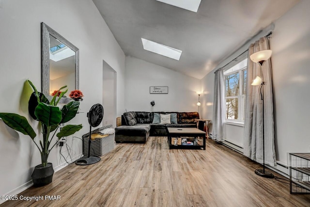 living room featuring wood-type flooring and lofted ceiling with skylight