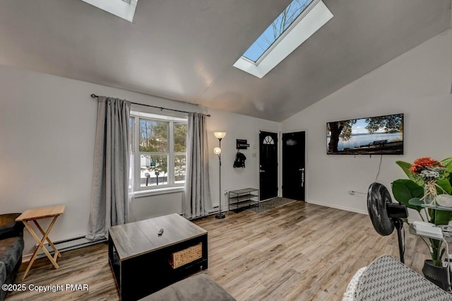 living room featuring lofted ceiling with skylight, hardwood / wood-style floors, and baseboard heating