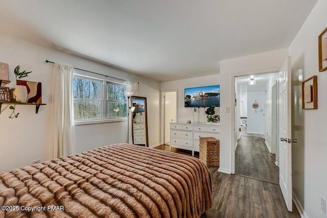 bedroom with wood-type flooring