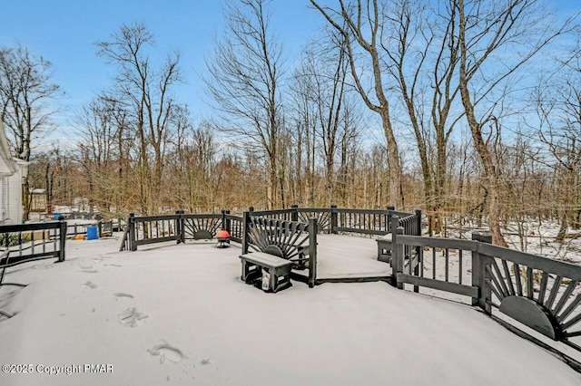 view of snow covered deck