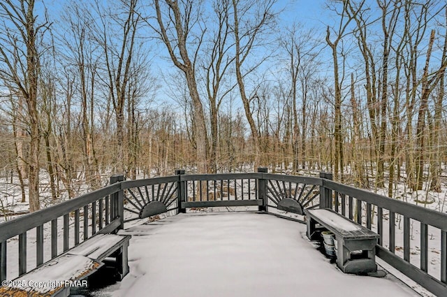 view of snow covered deck