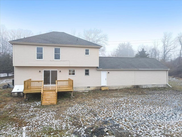 back of property featuring crawl space, roof with shingles, and a wooden deck