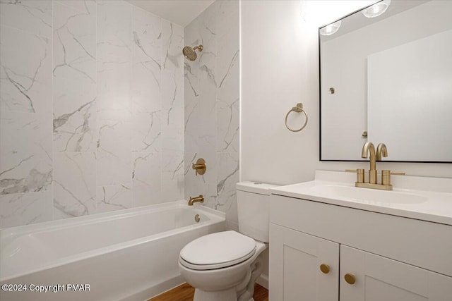 full bath featuring shower / bath combination, vanity, toilet, and wood finished floors