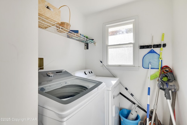 washroom featuring washer and clothes dryer