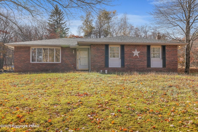 ranch-style home with a front yard