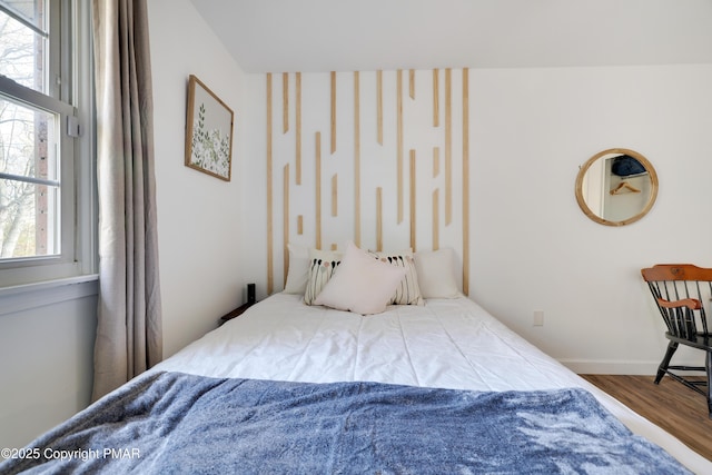 bedroom with wood-type flooring