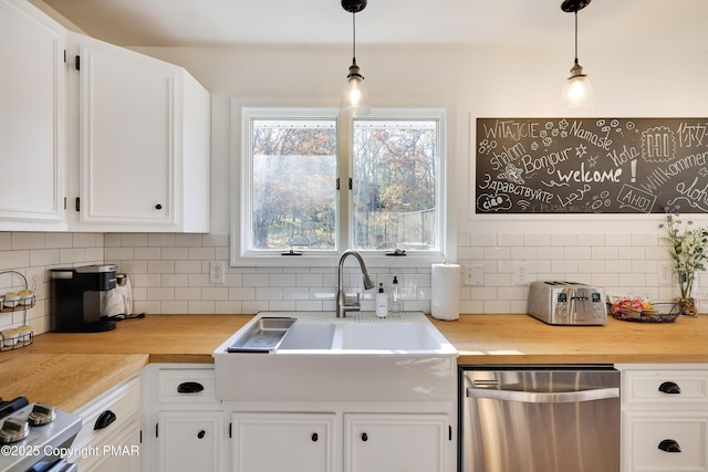 kitchen featuring white cabinetry, decorative backsplash, dishwasher, and hanging light fixtures