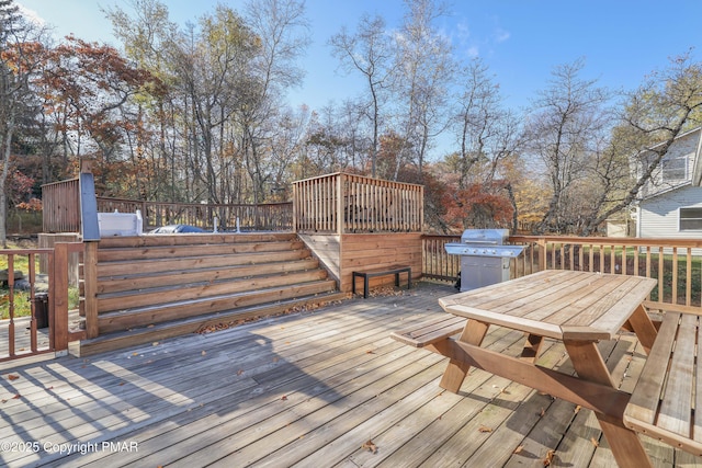 wooden terrace with area for grilling