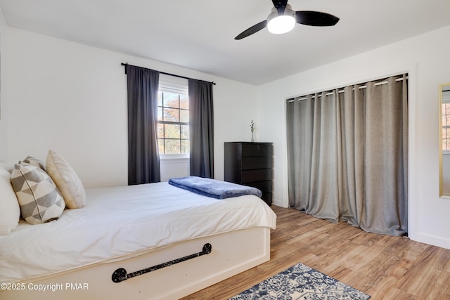 bedroom featuring hardwood / wood-style flooring and ceiling fan