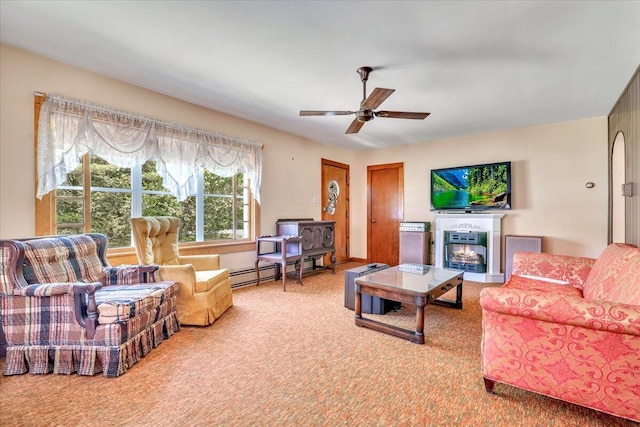 207 Scenic Dr, Kunkletown, PA 18058 - living area with carpet flooring, a glass covered fireplace, a baseboard radiator, and a ceiling fan