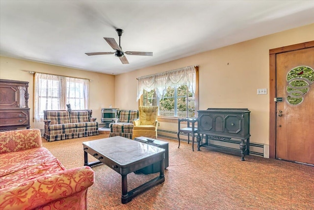 207 Scenic Dr, Kunkletown, PA 18058 - carpeted living room featuring ceiling fan, a wood stove, and a baseboard radiator