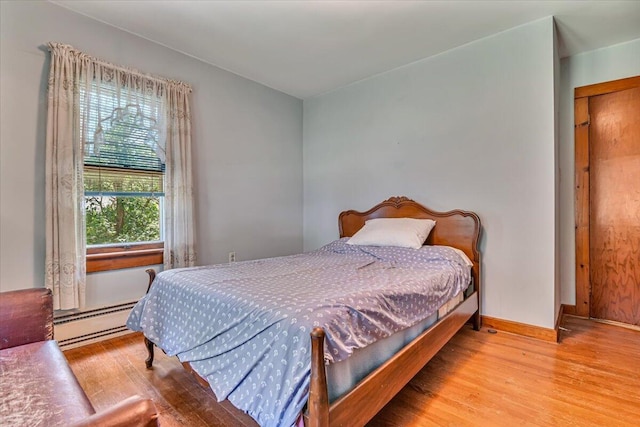 207 Scenic Dr, Kunkletown, PA 18058 - bedroom with a baseboard heating unit and wood finished floors