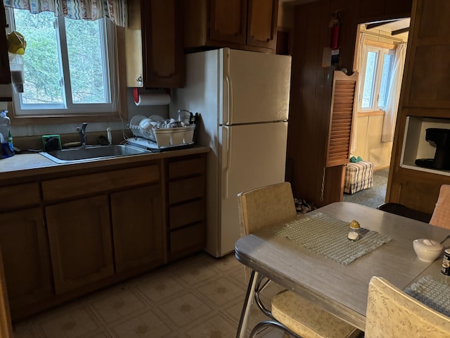 200 Onocop Dr, Pocono Lake, PA 18347 - kitchen with light floors, a sink, and freestanding refrigerator
