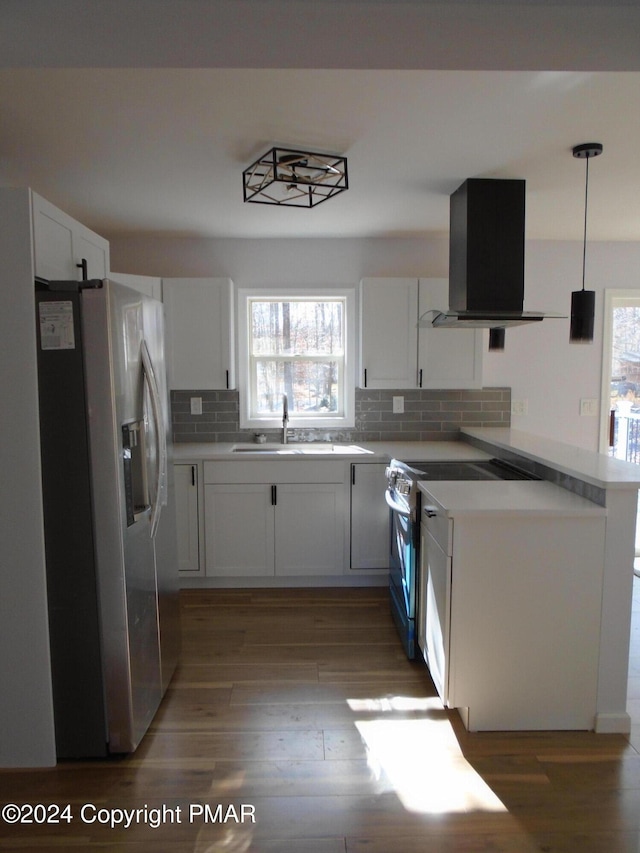 kitchen with island exhaust hood, a sink, electric range oven, stainless steel refrigerator with ice dispenser, and light wood-type flooring