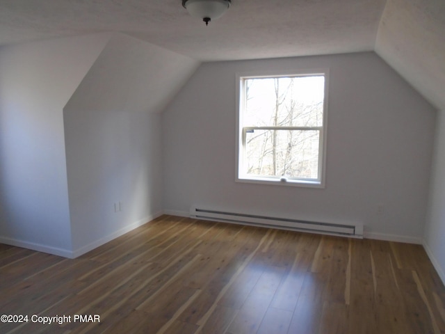 bonus room with vaulted ceiling, wood finished floors, baseboards, and a baseboard radiator