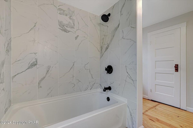 full bathroom featuring bathing tub / shower combination and wood finished floors