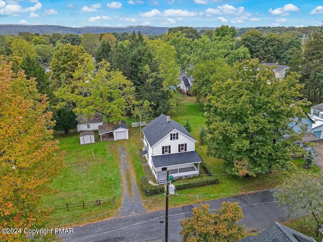 aerial view featuring a wooded view