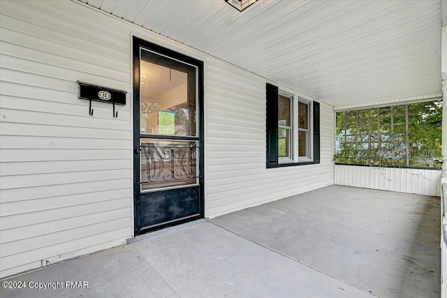 doorway to property featuring a porch