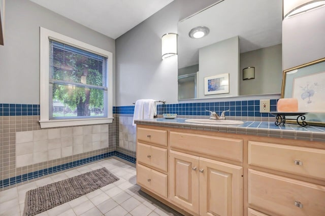 938 Meadow Cir, Bethlehem, PA 18017 - bathroom with tile walls, vanity, tile patterned floors, and a wainscoted wall