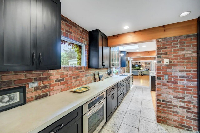 938 Meadow Cir, Bethlehem, PA 18017 - kitchen with dark speckled floor, light countertops, stainless steel oven, dark cabinetry, and recessed lighting