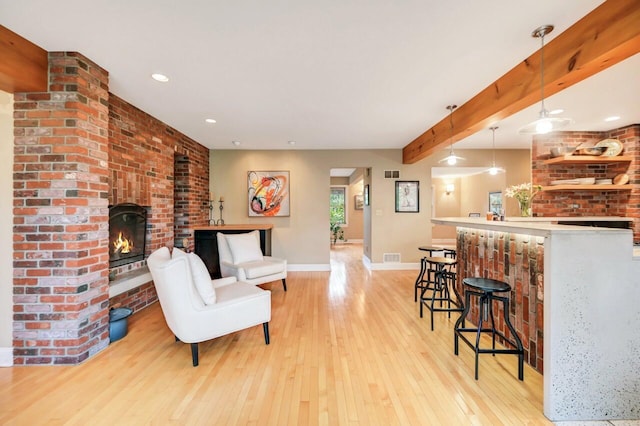 938 Meadow Cir, Bethlehem, PA 18017 - living room with a fireplace, light wood-style floors, beamed ceiling, and recessed lighting