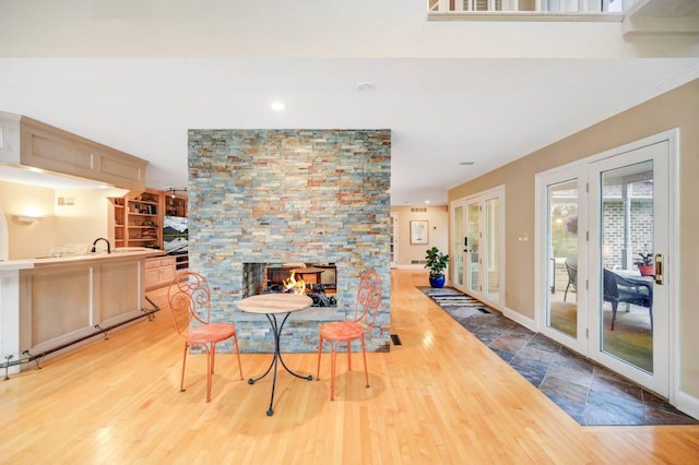 938 Meadow Cir, Bethlehem, PA 18017 - dining area with french doors, wood finished floors, recessed lighting, and a stone fireplace