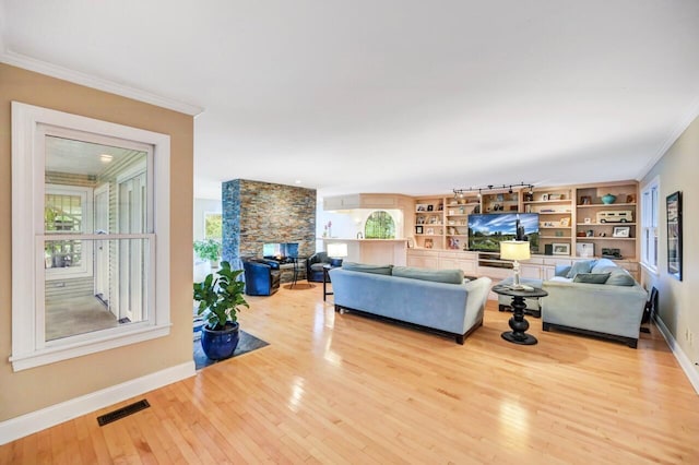 938 Meadow Cir, Bethlehem, PA 18017 - living area with crown molding, wood-type flooring, and a fireplace