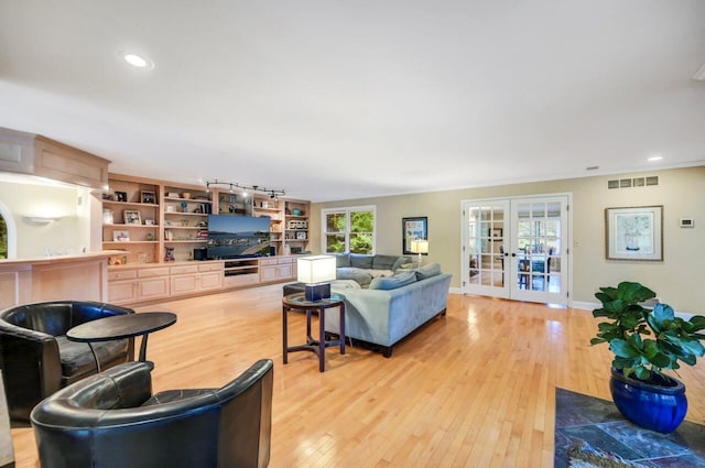 938 Meadow Cir, Bethlehem, PA 18017 - living area featuring french doors, light wood finished floors, and recessed lighting