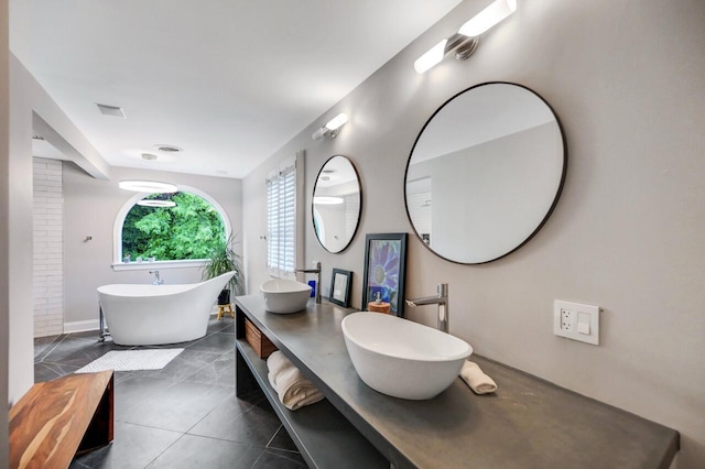 938 Meadow Cir, Bethlehem, PA 18017 - full bath with a freestanding bath, double vanity, and tile patterned floors