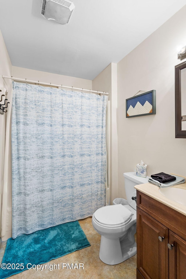 bathroom featuring visible vents, vanity, and toilet